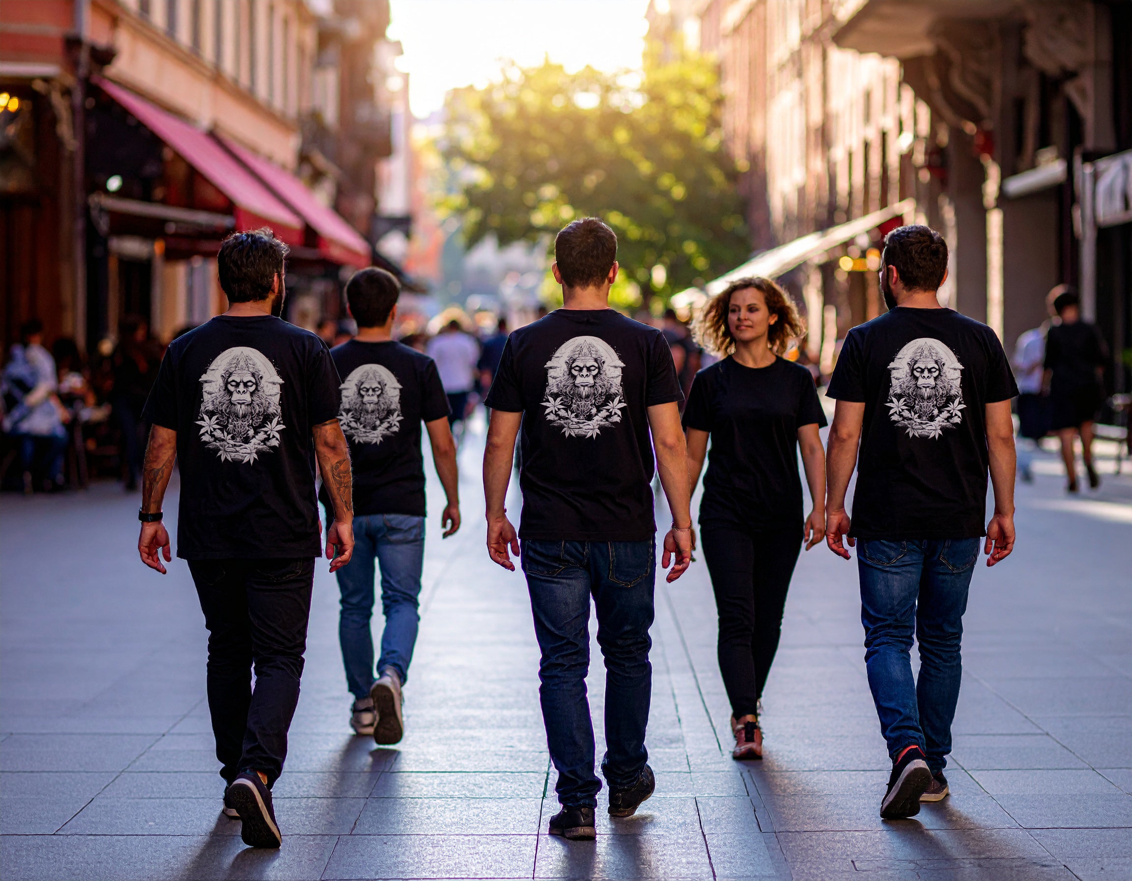 Group of people walking down a city street wearing matching My CannaBod t-shirts with Ancient Wisdom on the back.